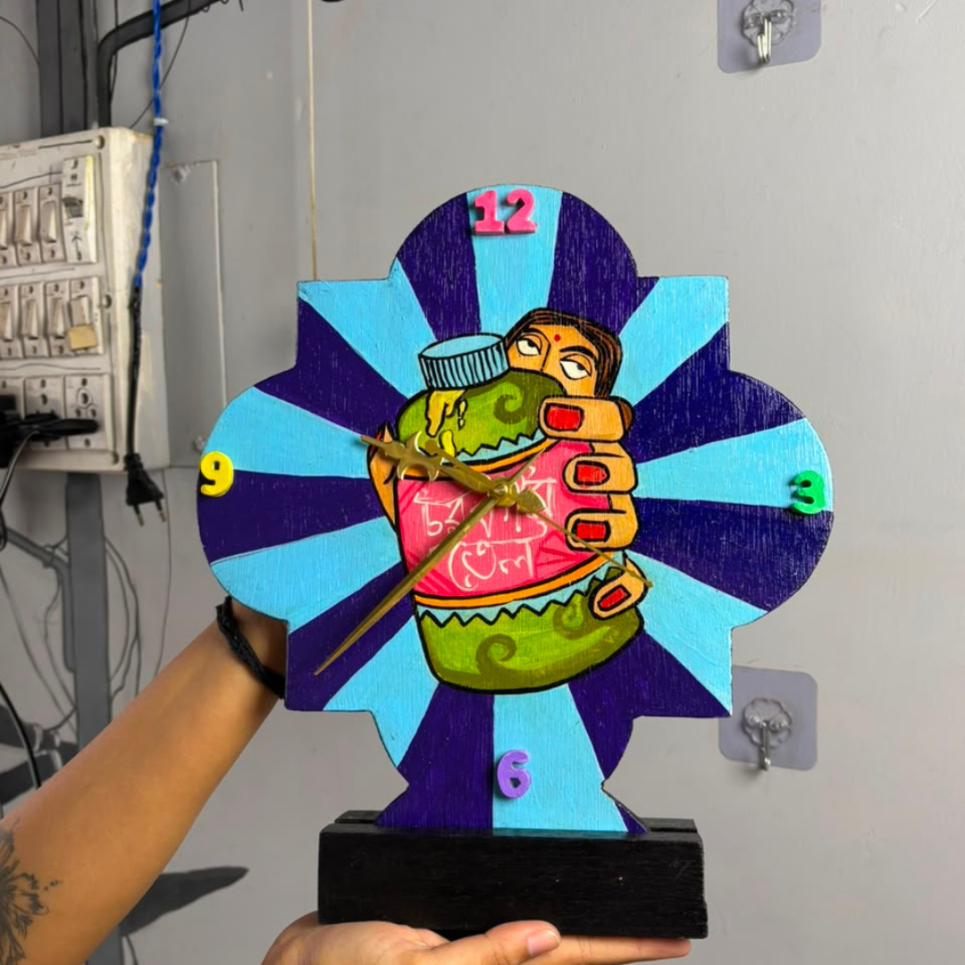 wooden table clock displayed in hand to showcase the hand painted clock