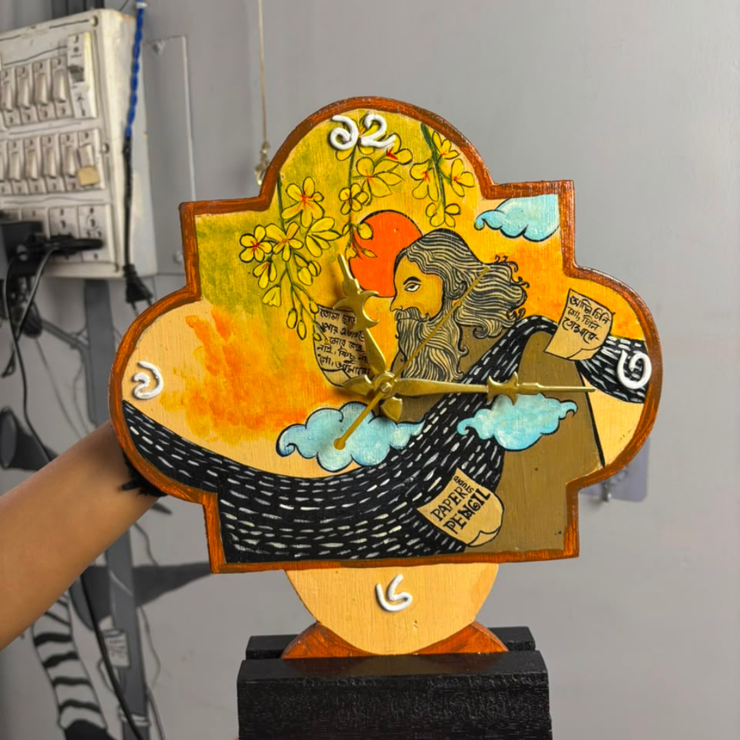 wooden table clock displayed in hand to showcase the clock and its hand painted art of Rabindranath Tagore 